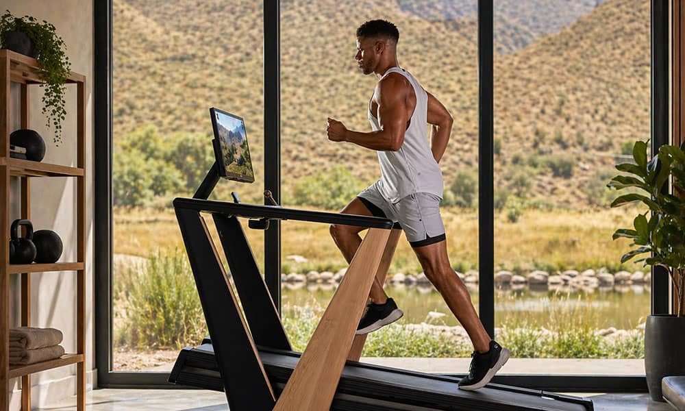 Man running on treadmill in home gym