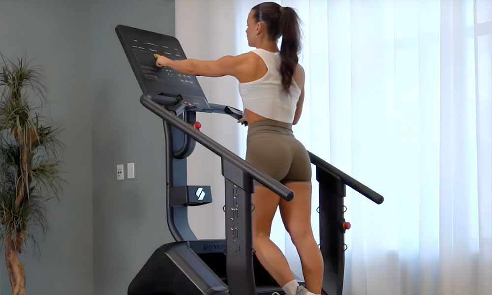 Woman using stepper in living room