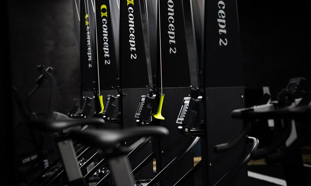 Row of cardio machines used in HYROX
